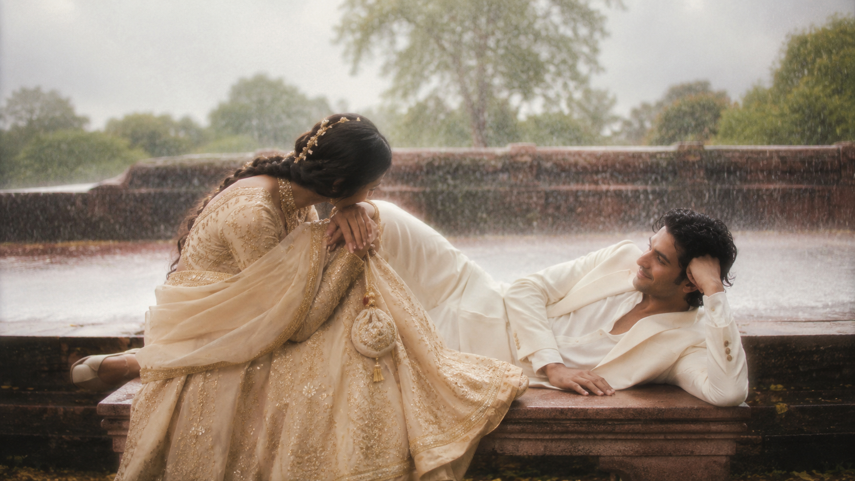 Indian bride and groom in the rain — a moment of quiet devotion